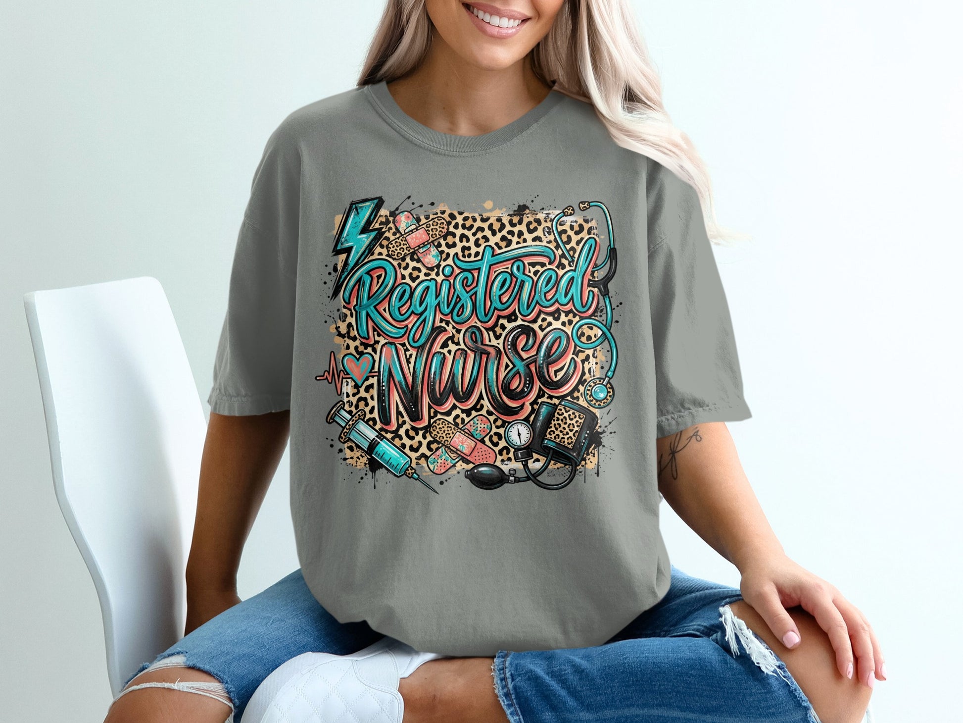 Grey t-shirt with "Registered Nurse" text and medical graphics.