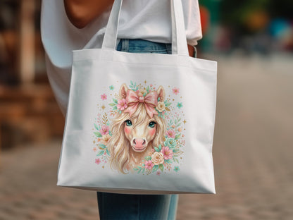 White tote bag with a pastel illustration of a pony wearing a pink bow.