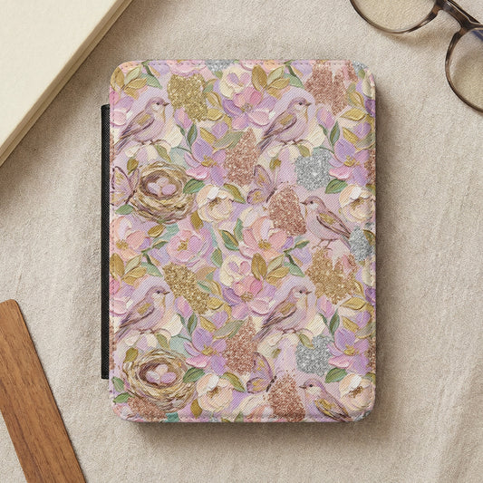 E-reader cover with a floral and bird pattern in pastel colors.