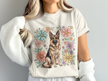 Cream t-shirt with a sitting German Shepherd surrounded by pastel flowers.