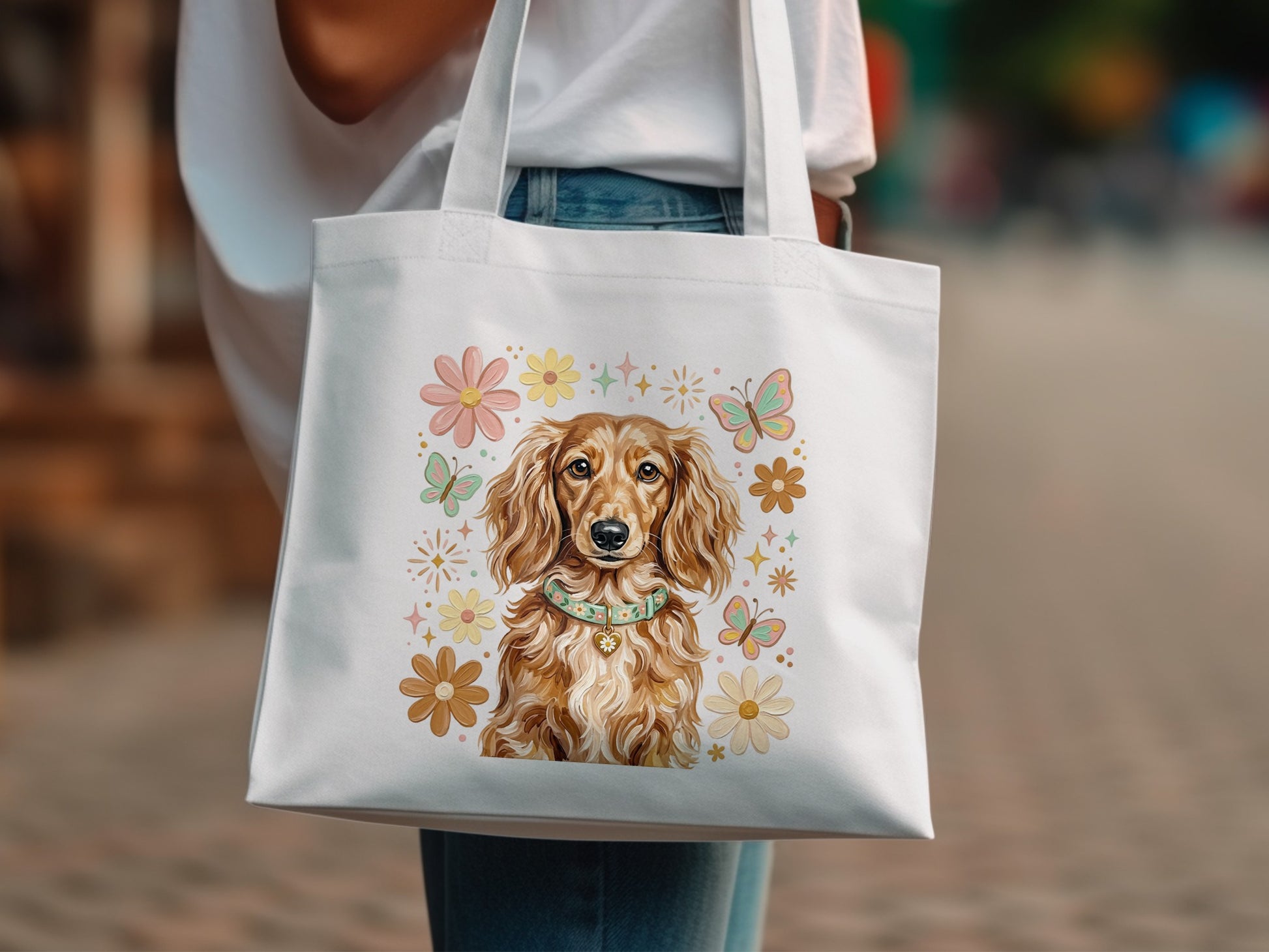 White tote bag with dachshund wearing collar and floral butterfly design.