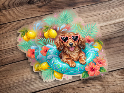 Dachshund in a float with sunglasses, lemons, and tropical flowers.
