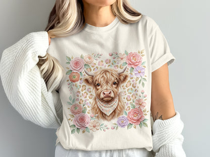Cream t-shirt with Highland cow wearing bandana, surrounded by floral watercolor design.