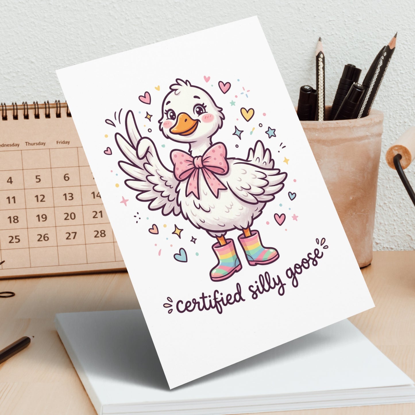 Card featuring a cartoon goose wearing pink boots and a bow, with text "certified silly goose".