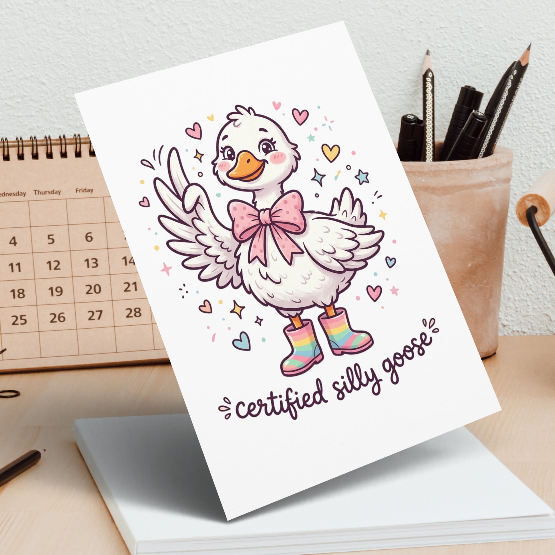 Card featuring a cartoon goose wearing pink boots and a bow, with text "certified silly goose".