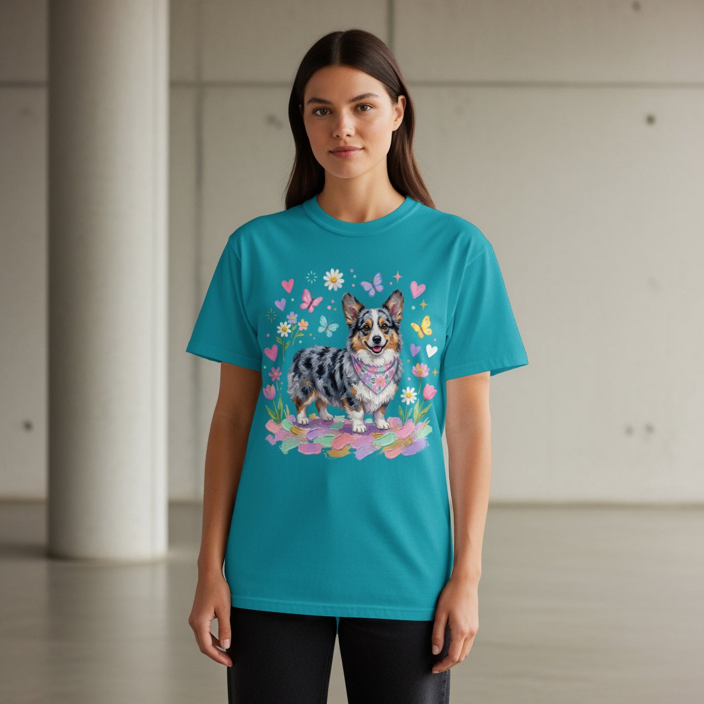 Woman wearing teal t-shirt with watercolor corgi and flowers.