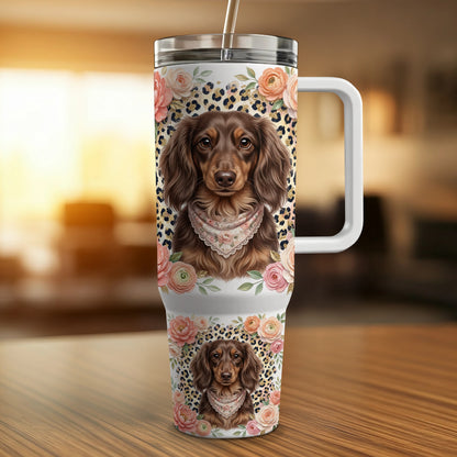 Dachshund wearing bandana on floral and leopard print tumbler with handle.