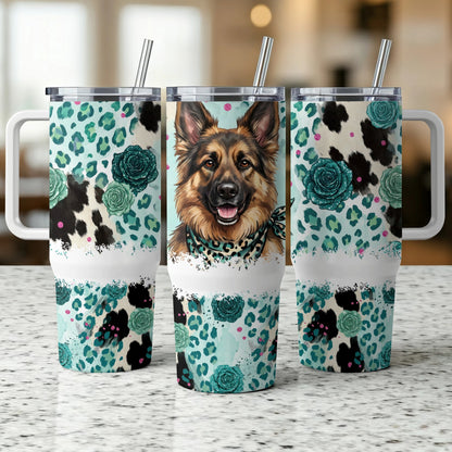 German Shepherd on a teal, floral, and cow print tumbler.