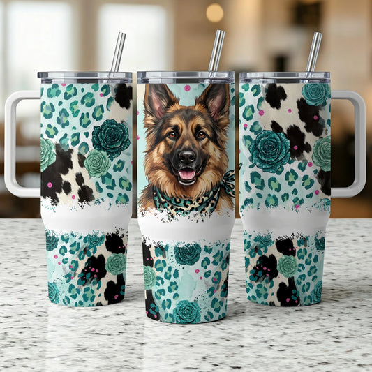 German Shepherd on a teal, floral, and cow print tumbler.