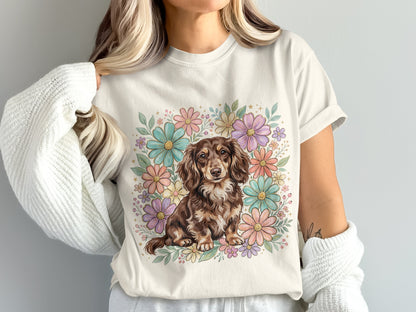 Dachshund in floral wreath on light t-shirt.