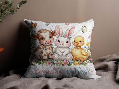 Cute cow, bunny, and duckling with flowers and butterflies on a pillow.