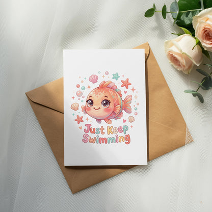 Card with a cute fish and "Just Keep Swimming" text, on an envelope.