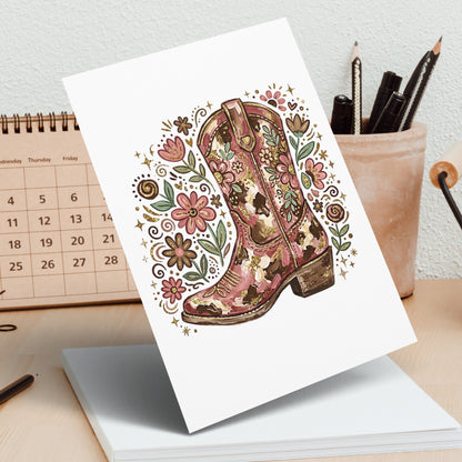 Illustrated cowboy boot with floral and glitter details on a notepad.