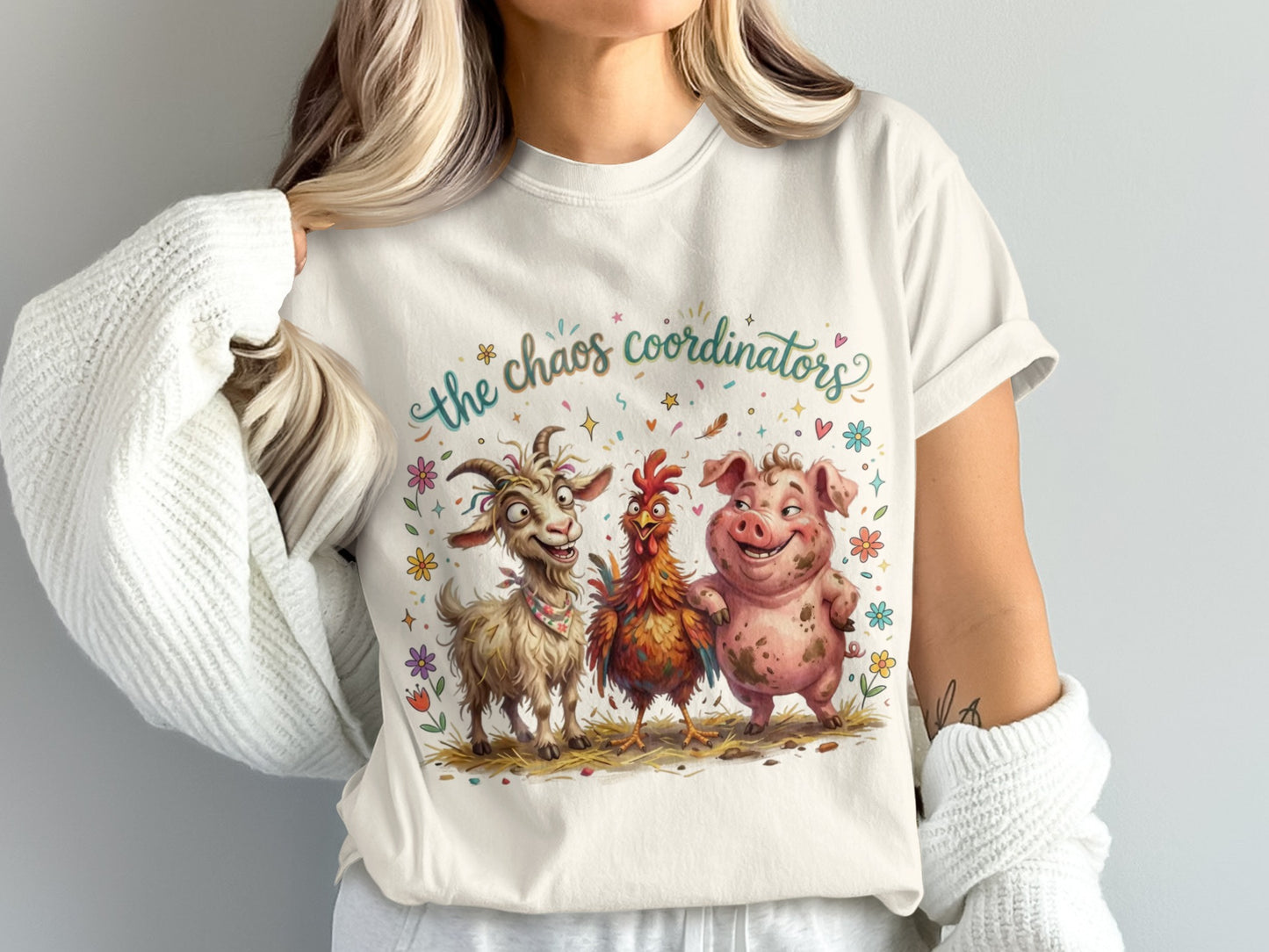 T-shirt with cartoon goat, pig, and chicken saying "The Chaos Coordinators".