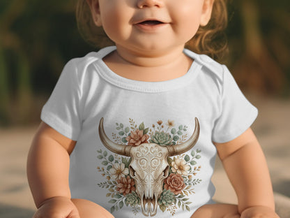 Baby in white onesie with floral bull skull graphic.