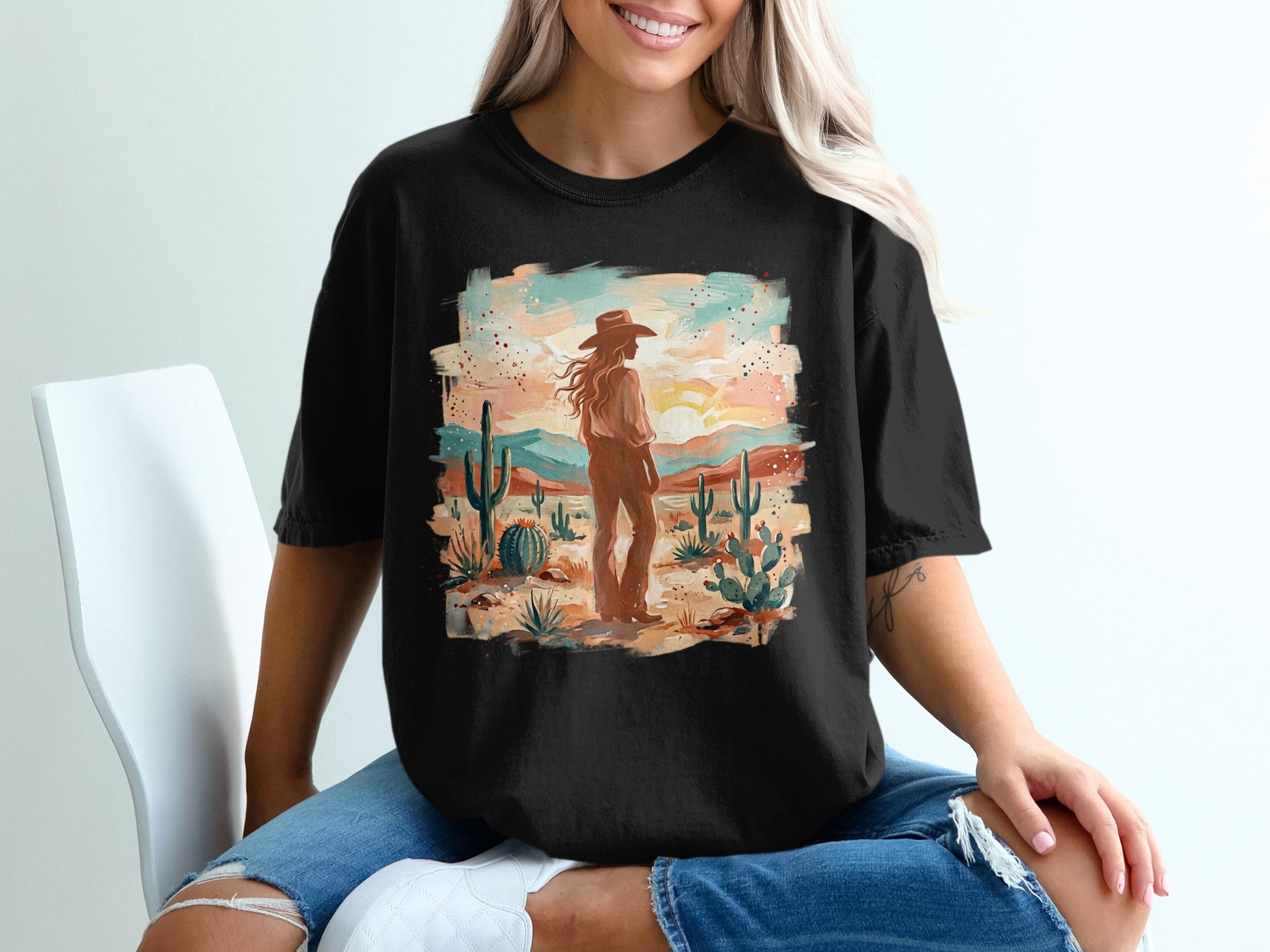 Cowgirl in desert landscape with cacti and mountains at sunset.