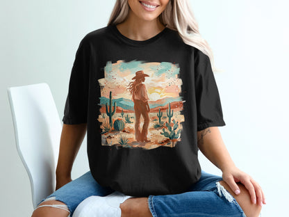 Cowgirl in desert landscape with cacti and mountains at sunset.