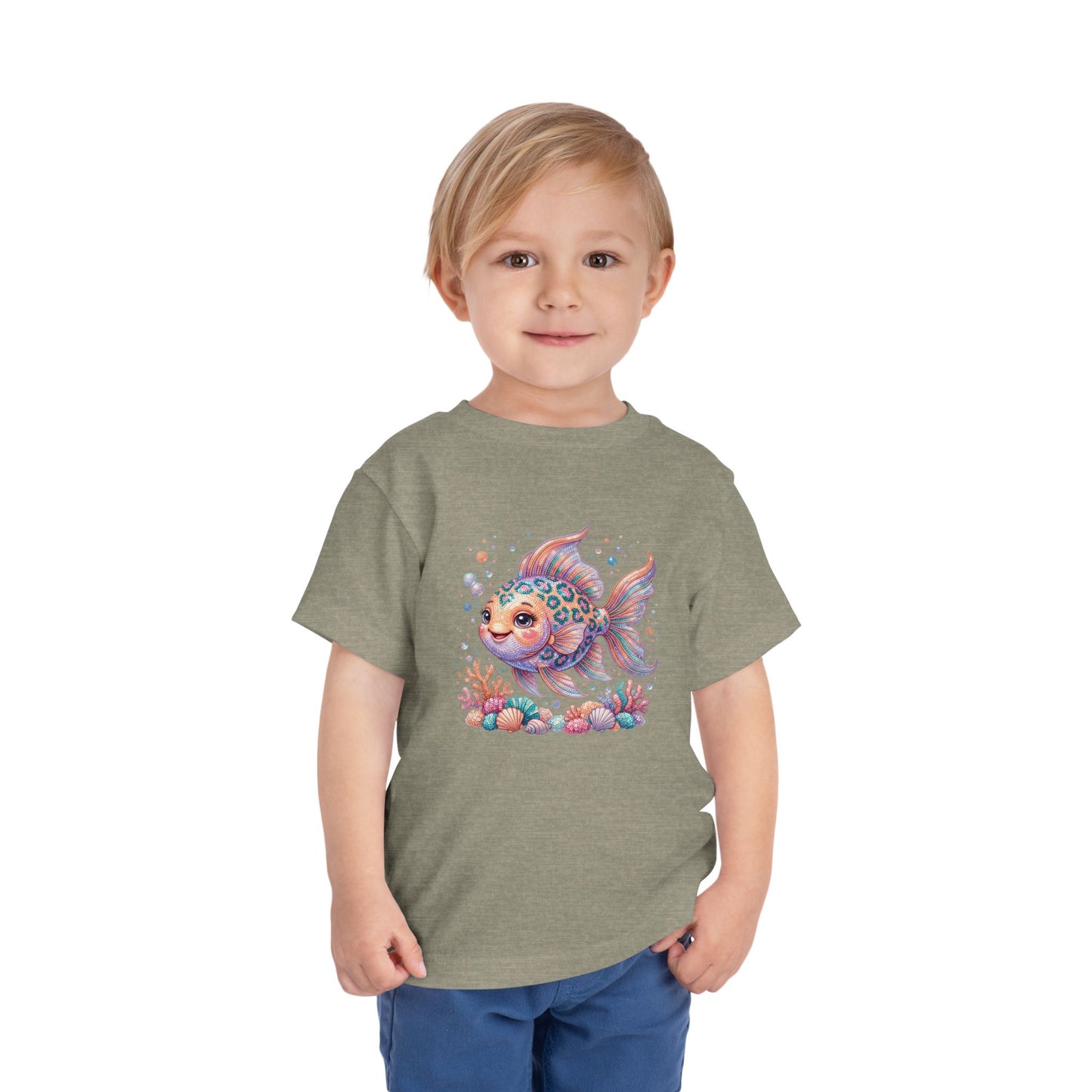 Toddler wearing a grey t-shirt with a colorful cartoon fish and seashells.