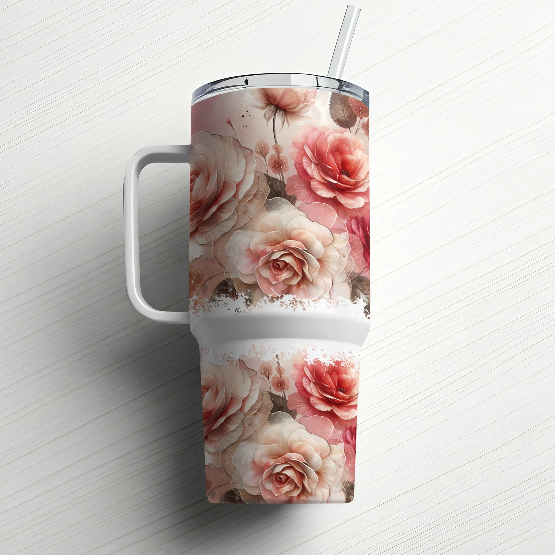 Pink and white roses adorn a large white insulated tumbler with a straw.