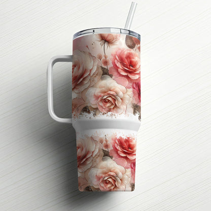 Pink and white roses adorn a large white insulated tumbler with a straw.