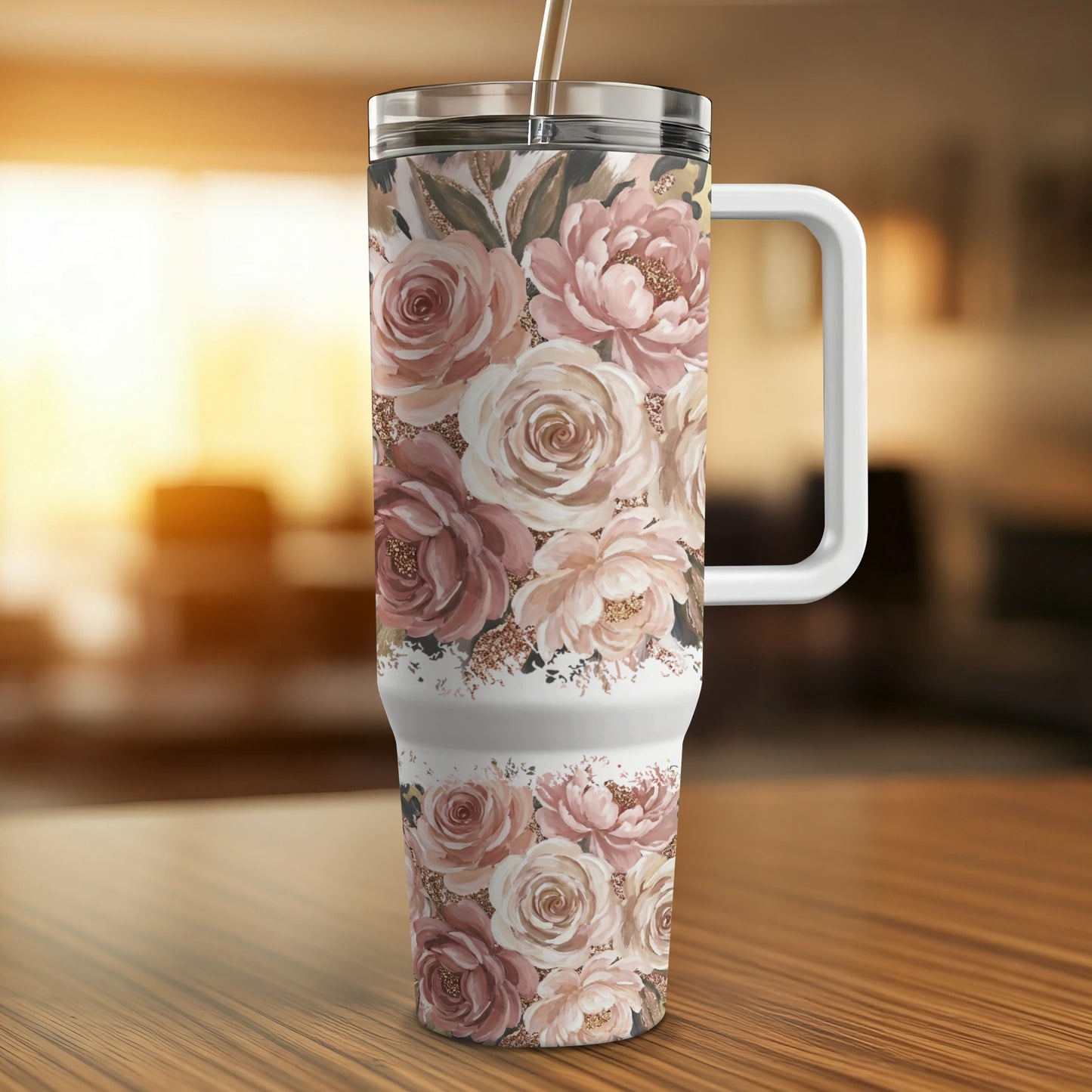 Floral pattern tumbler with a white handle on a wooden table.