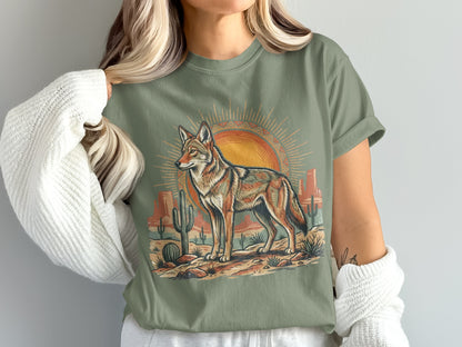 Coyote standing in a desert landscape with sun and cacti, vintage style graphic.