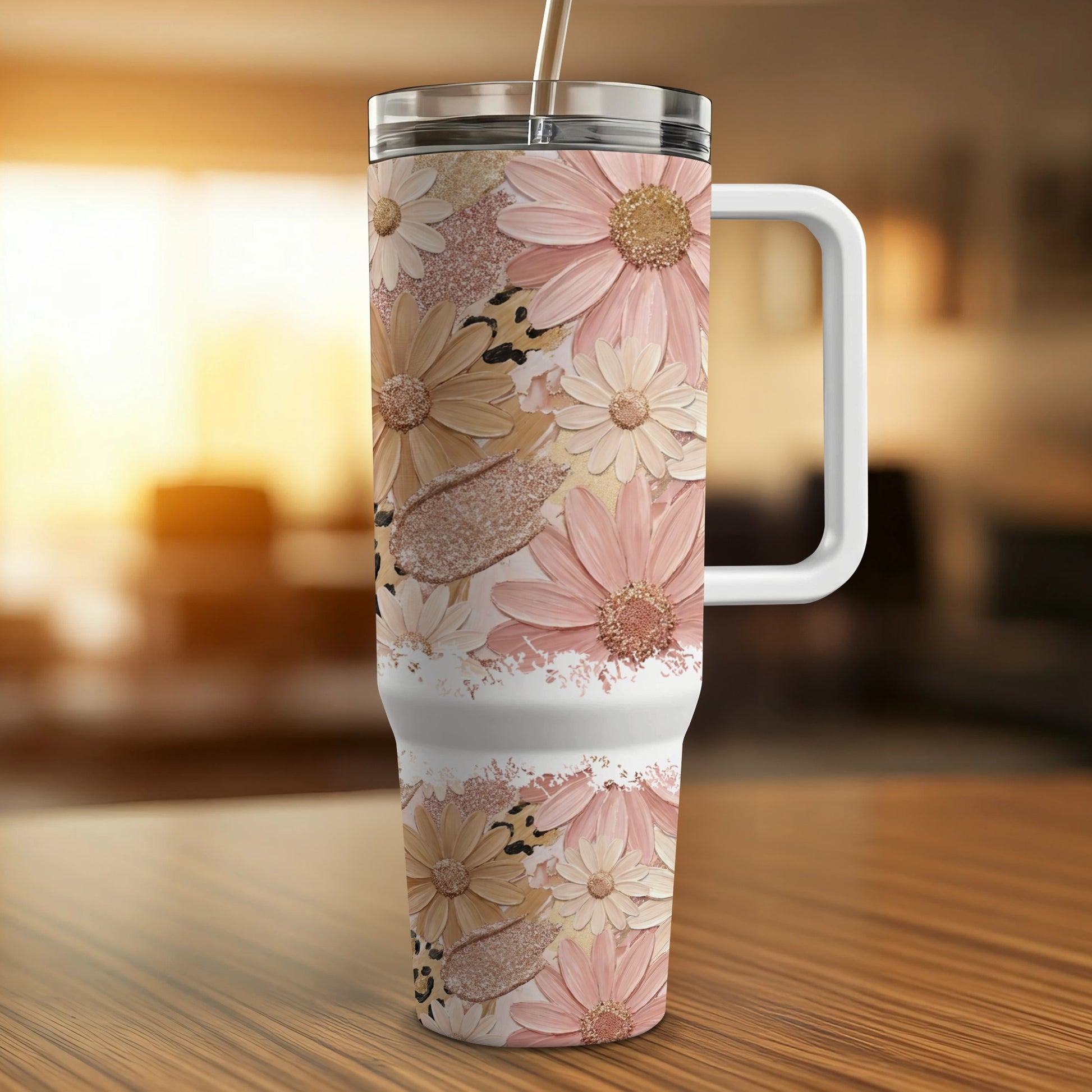 Floral and leopard print tumbler with white handle and silver straw.