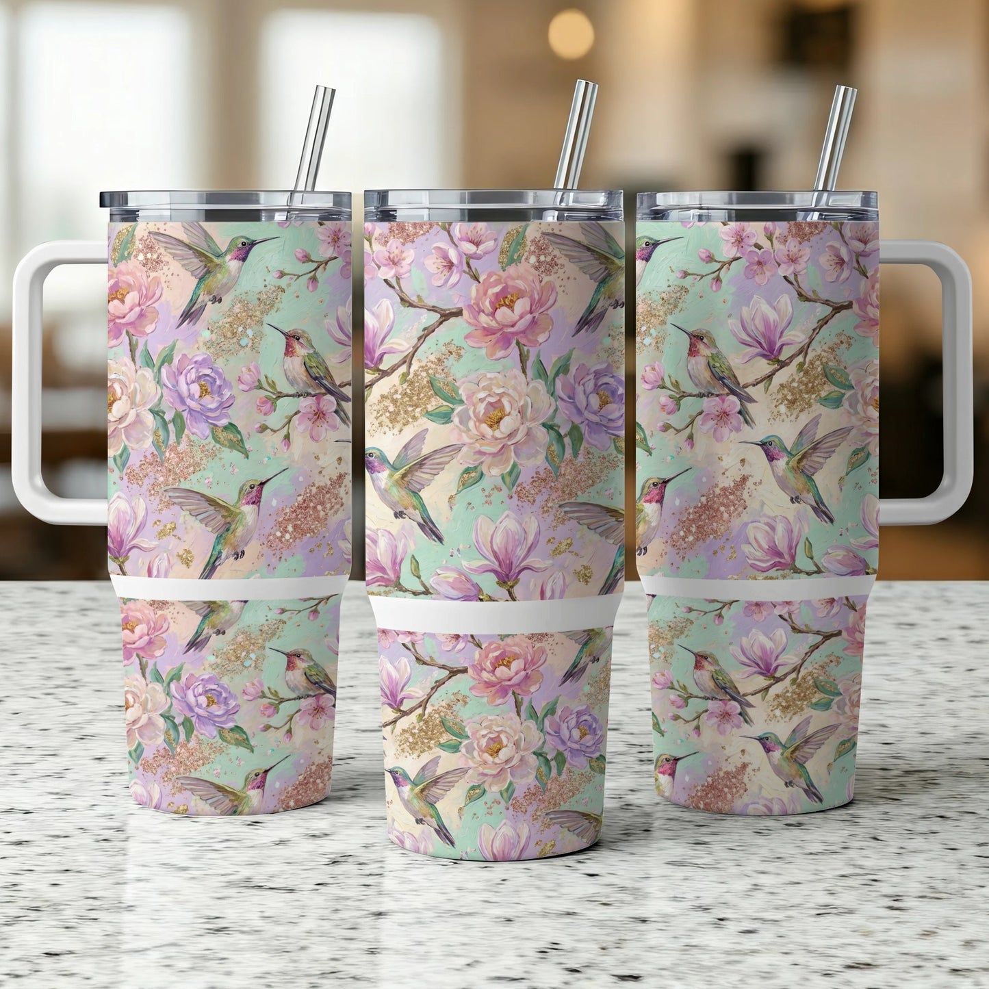 Three tumblers with a floral and hummingbird design.