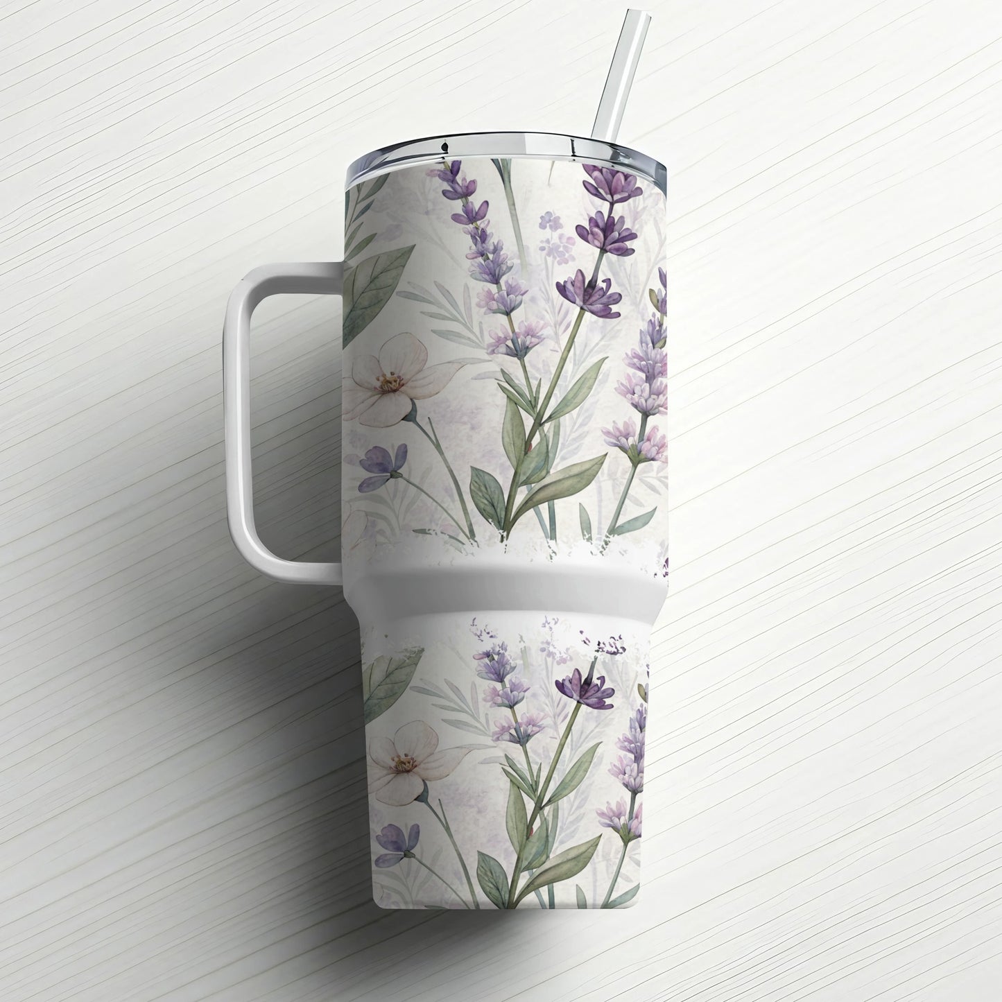 White tumbler with lavender floral pattern and handle.