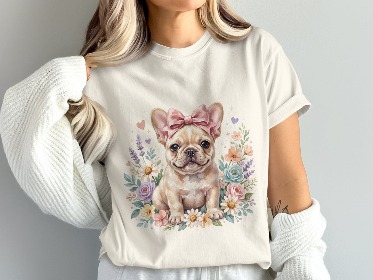 Cream t-shirt featuring a watercolor French bulldog with a pink bow and floral wreath.