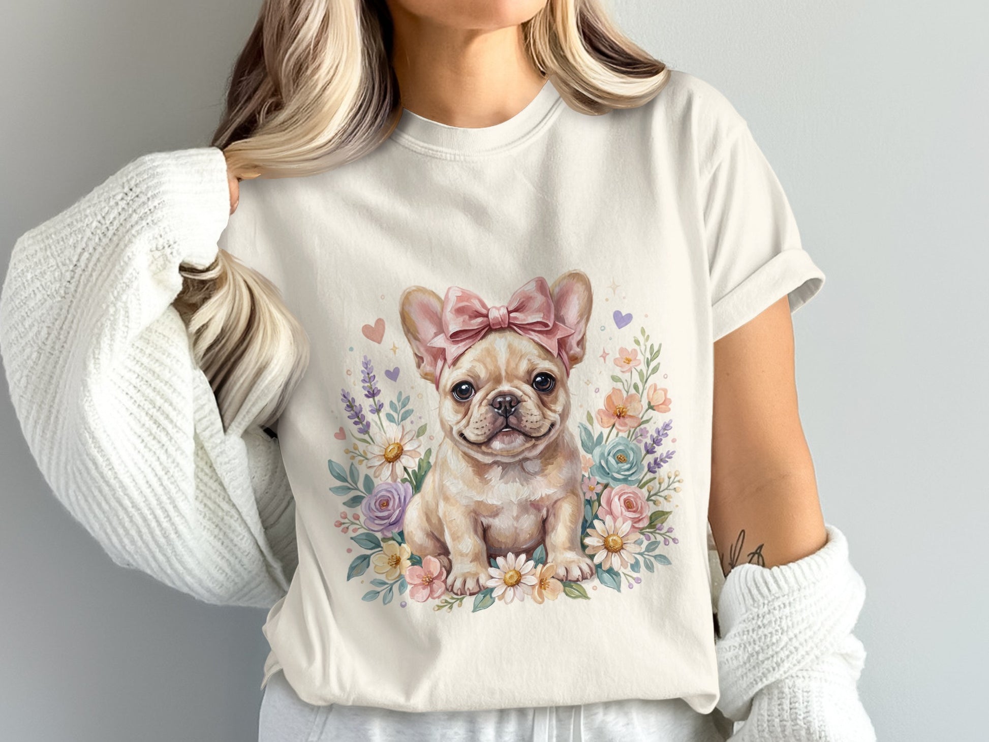 Cream t-shirt featuring a watercolor French bulldog with a pink bow and floral wreath.