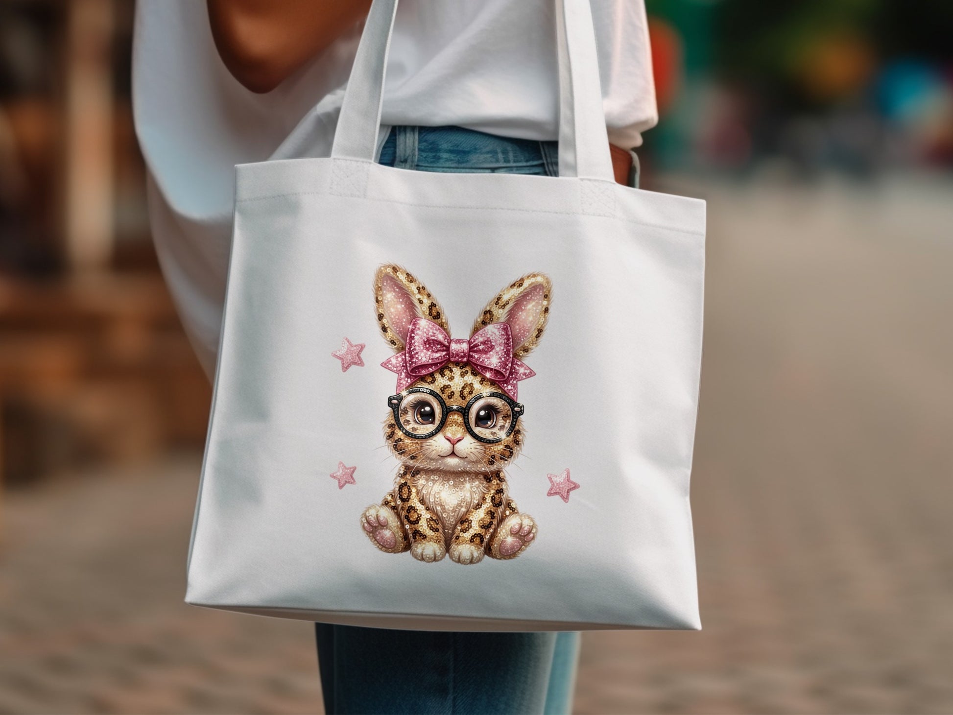 White tote bag with sequined bunny wearing glasses and pink bow.