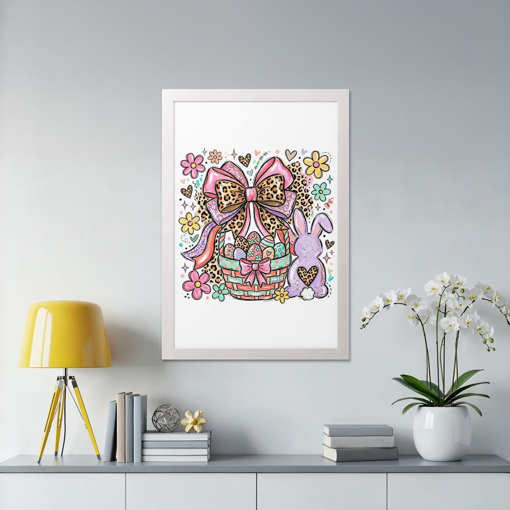 Easter basket with bunny, bow, and flowers in a white frame.