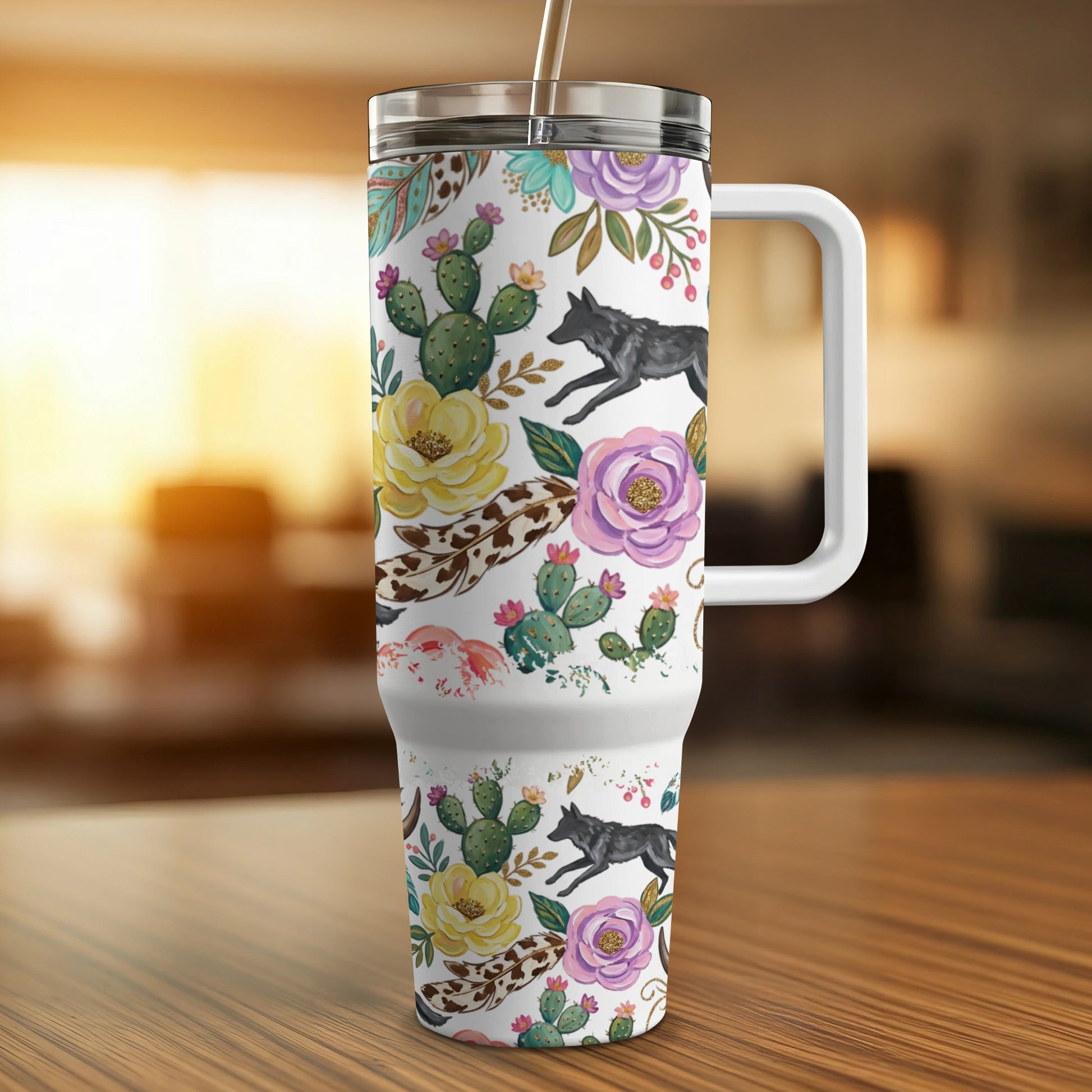 White tumbler with floral, cactus, and wolf pattern.