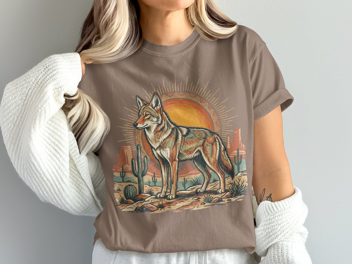 Coyote standing in desert landscape with sun and cacti.