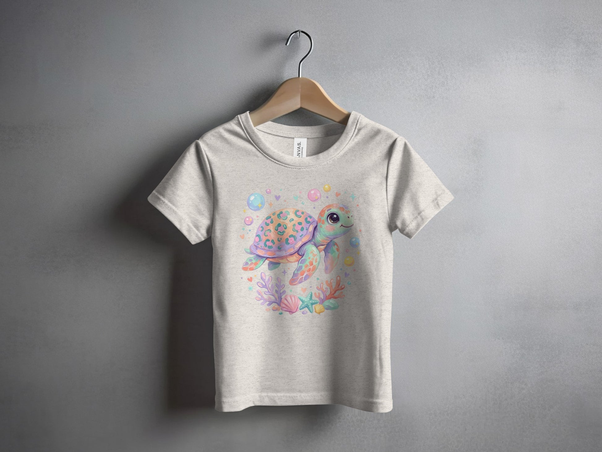 Children's t-shirt with watercolor sea turtle, bubbles, and coral design.