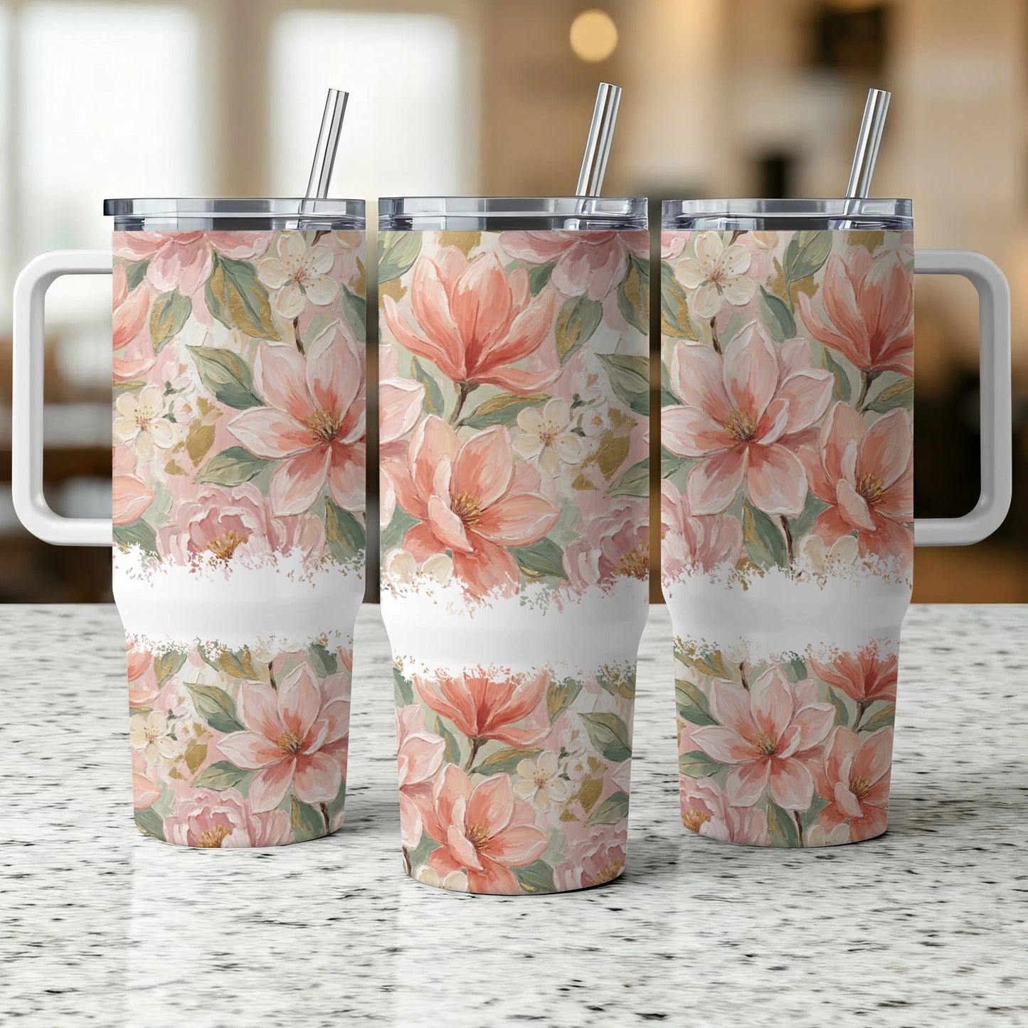 Three tumblers with a floral pattern of pink and white magnolias and greenery.