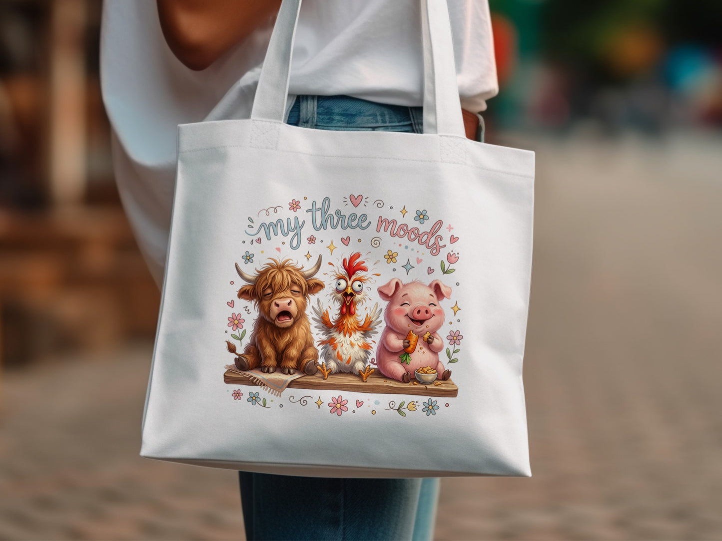 Cartoon highland cow, chicken, and pig wearing flower crowns on tote bag.