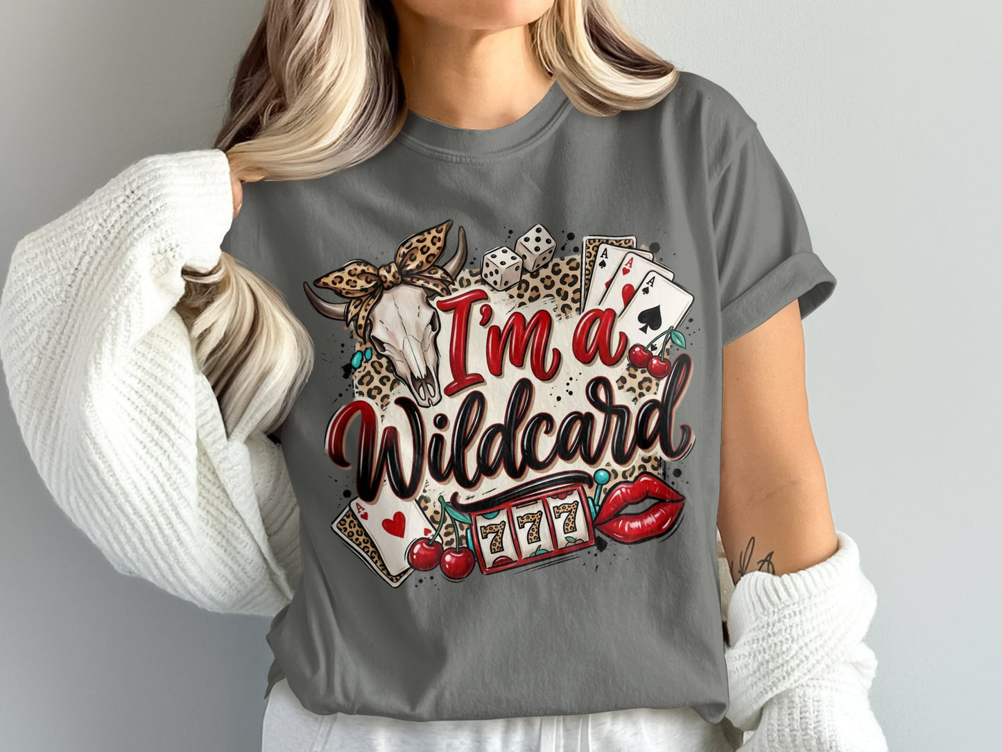 Woman wearing a grey t-shirt with a "I'm a Wildcard" graphic and casino imagery.