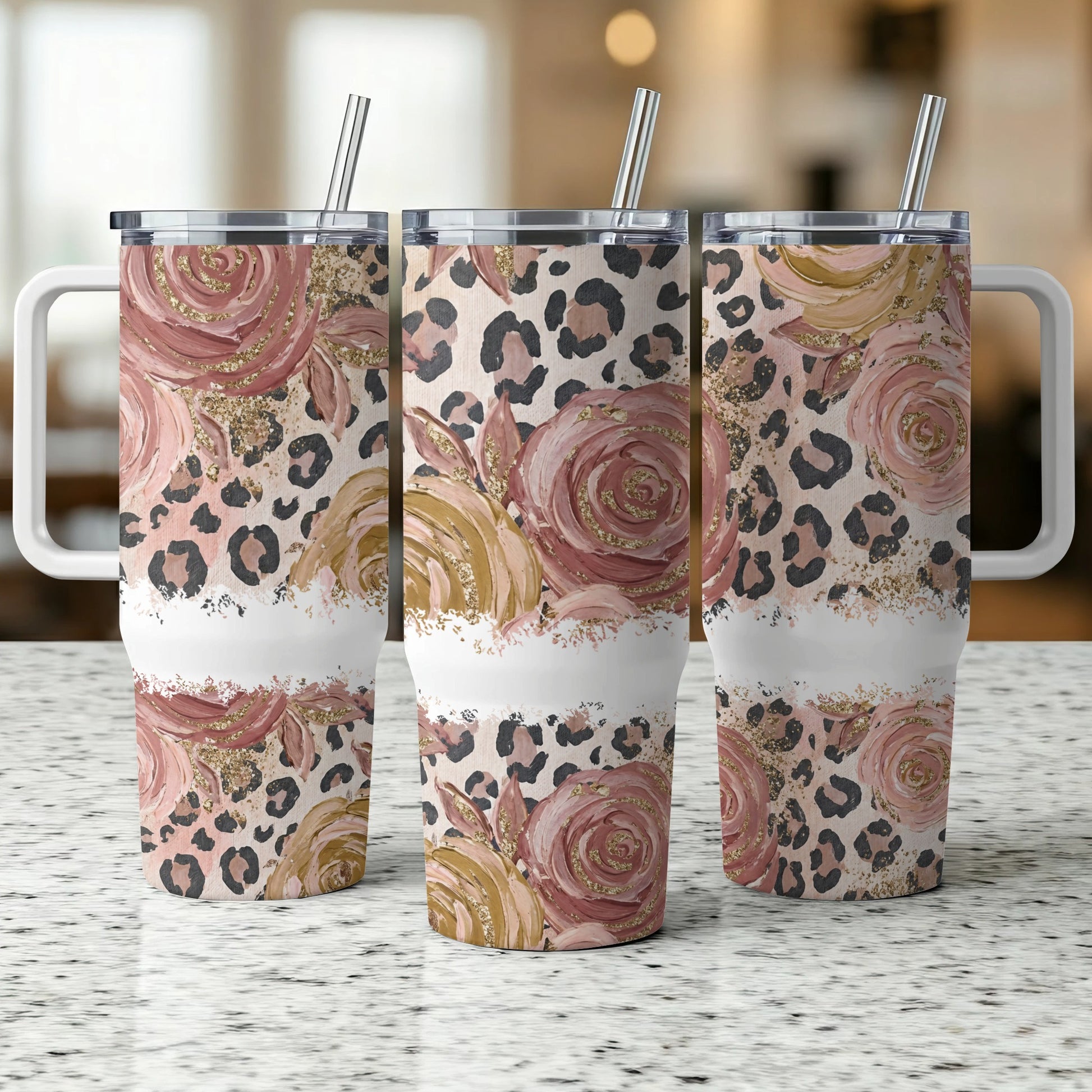 Three tumblers with floral and leopard print patterns.