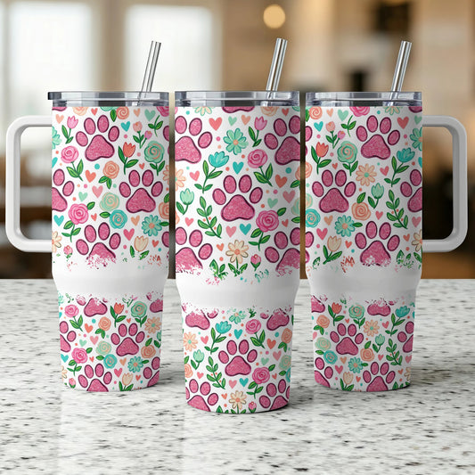 Three tumblers with pink paw print and floral pattern, featuring handles and straws.