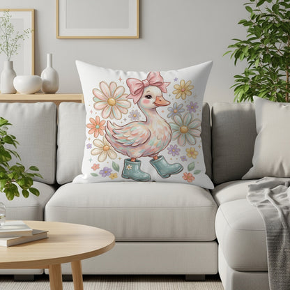 Cartoon duck wearing blue boots and pink bow on white couch with flowers.