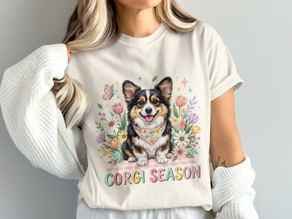 Corgi wearing bandana surrounded by flowers and butterflies, "Corgi Season" text.