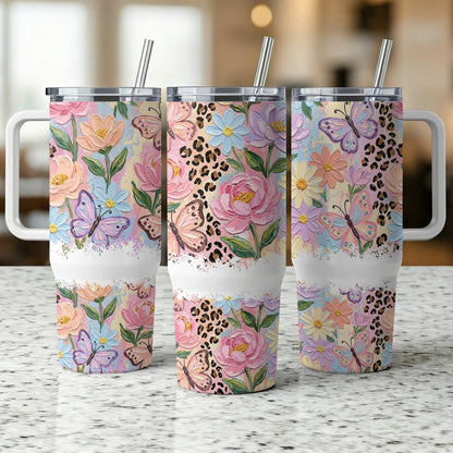 Three tumblers with floral and butterfly designs and leopard print accents.