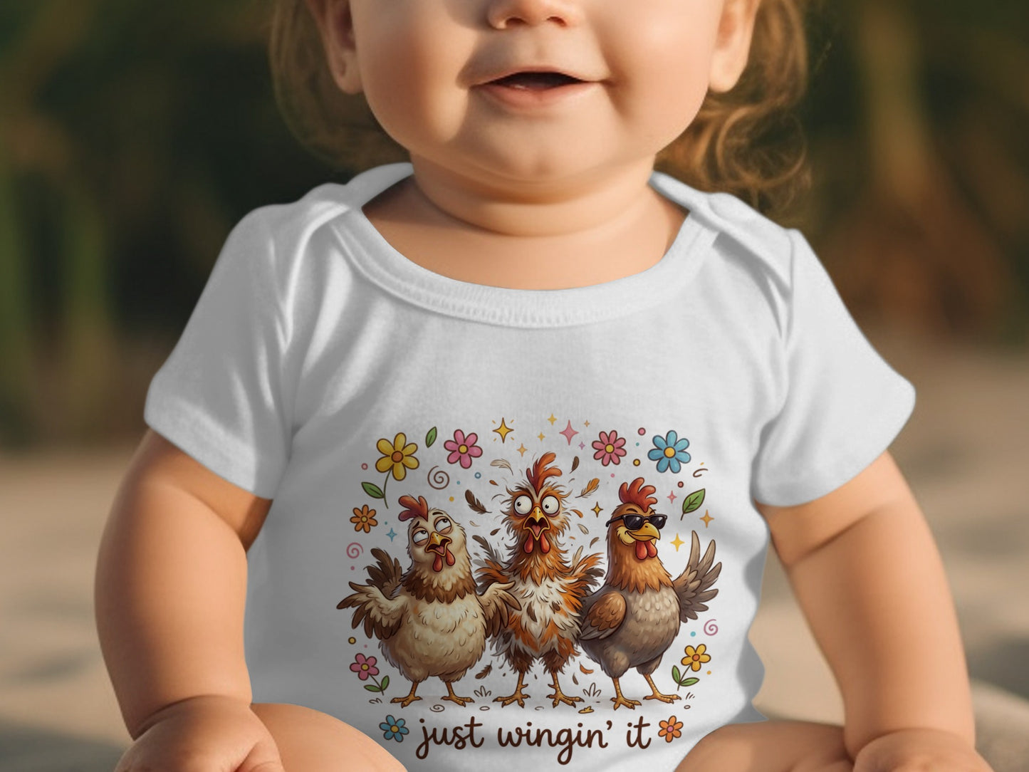 Baby in white onesie with "just wingin' it" and three cartoon chickens.