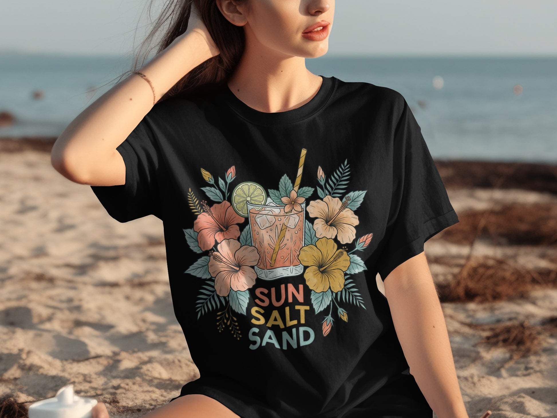 Black t-shirt with floral design and "Sun Salt Sand" text.