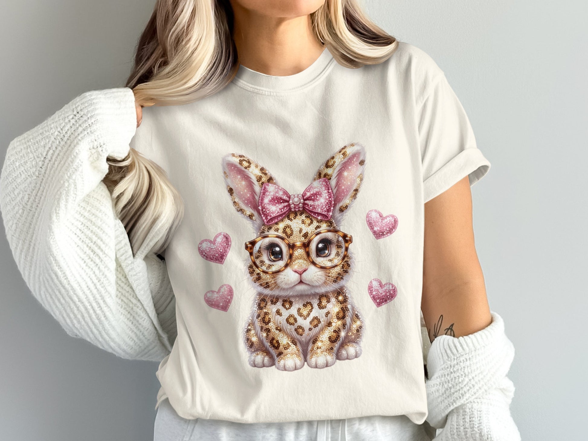 Graphic t-shirt with leopard print bunny wearing glasses and pink bow.
