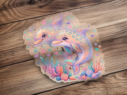 Two playful cartoon dolphins surrounded by seashells and coral reefs.