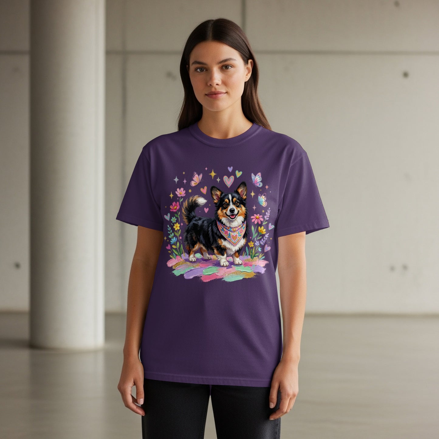 Woman wearing dark purple t-shirt with a corgi dog wearing a bandana illustration.