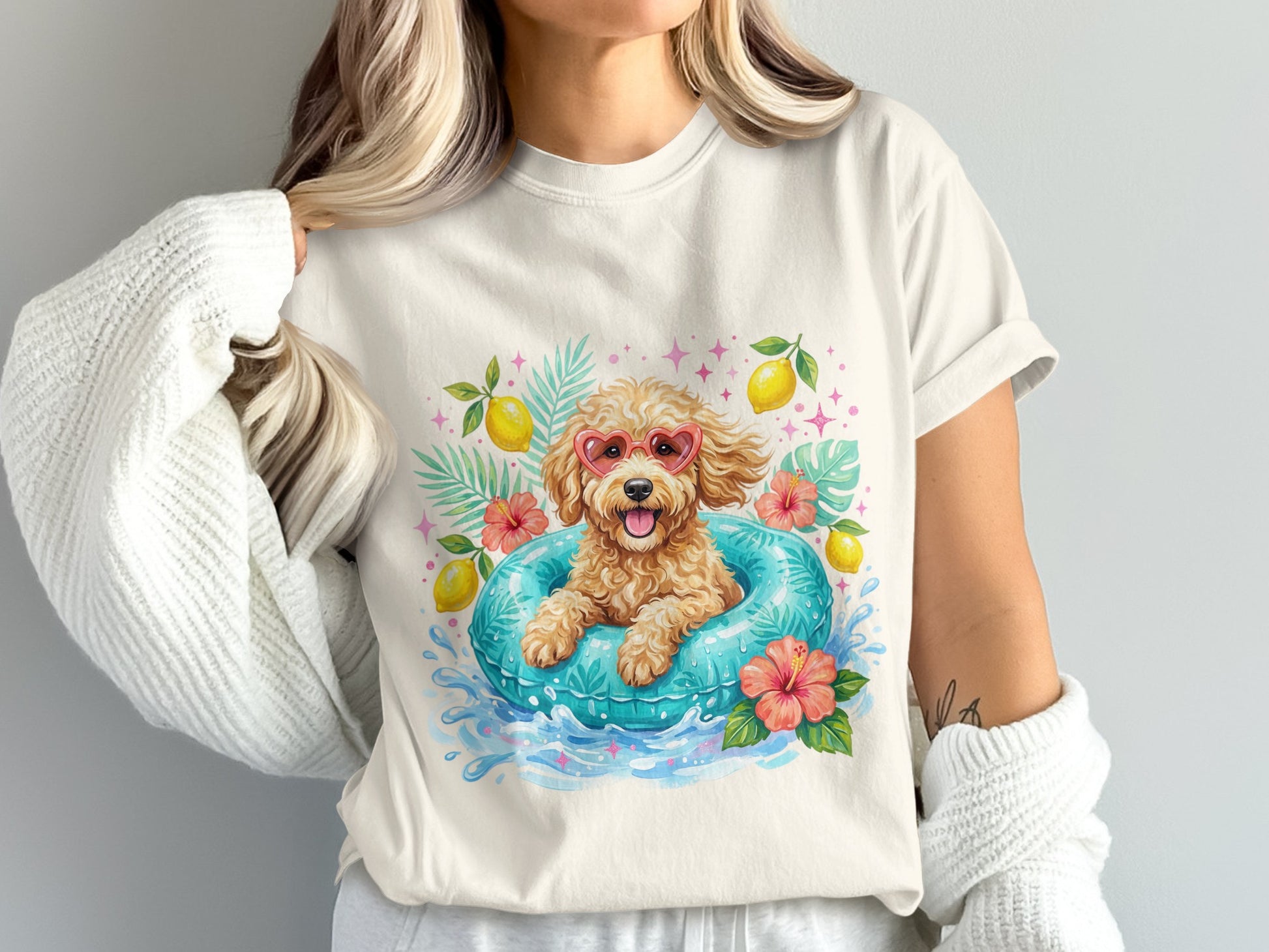 Dog in heart-shaped sunglasses floats in a pool with lemons and flowers.